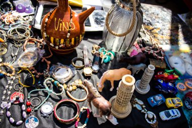 Seville, Spain - July 14, 2022 Various objects sold at the Flea market, also known as Mercadillo Historico Del Jueves, locals are busy poking around looking for bargains in the narrow Calle Feria