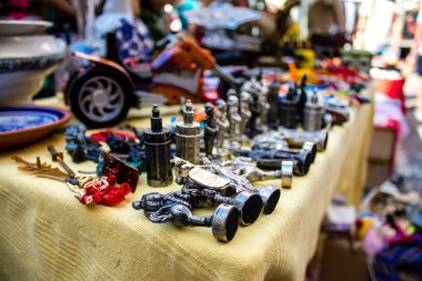 Seville, Spain - July 14, 2022 Various objects sold at the Flea market, also known as Mercadillo Historico Del Jueves, locals are busy poking around looking for bargains in the narrow Calle Feria