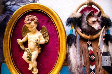 Seville, Spain - July 14, 2022 Various objects sold at the Flea market, also known as Mercadillo Historico Del Jueves, locals are busy poking around looking for bargains in the narrow Calle Feria