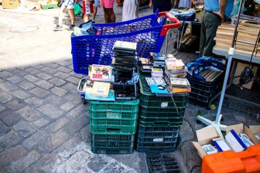 Seville, Spain - July 14, 2022 Various objects sold at the Flea market, also known as Mercadillo Historico Del Jueves, locals are busy poking around looking for bargains in the narrow Calle Feria