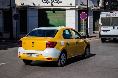 Tetouan, Morocco - August 17, 2022 Taxi driving through the streets of Tetouan during the coronavirus outbreak hitting Morocco, wearing a mask is mandatory