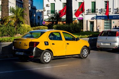 Tetouan, Morocco - August 17, 2022 Taxi driving through the streets of Tetouan during the coronavirus outbreak hitting Morocco, wearing a mask is mandatory