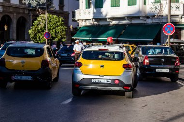Tetouan, Morocco - August 17, 2022 Taxi driving through the streets of Tetouan during the coronavirus outbreak hitting Morocco, wearing a mask is mandatory