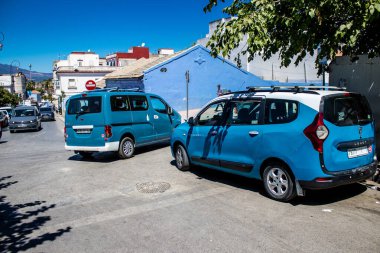 Tetouan, Morocco - August 17, 2022 Taxi driving through the streets of Tetouan during the coronavirus outbreak hitting Morocco, wearing a mask is mandatory