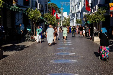 Tetouan, Morocco - August 18, 2022 Arabic people walking in the busy street of Tetouan, the city has a narrow and winding Arabic layout typical of oriental cities