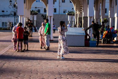 Tetouan, Morocco - August 18, 2022 Arabic people walking in the busy street of Tetouan, the city has a narrow and winding Arabic layout typical of oriental cities