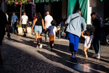 Tetouan, Morocco - August 18, 2022 Arabic people walking in the busy street of Tetouan, the city has a narrow and winding Arabic layout typical of oriental cities