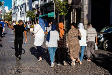 Tetouan, Morocco - August 18, 2022 Arabic people walking in the busy street of Tetouan, the city has a narrow and winding Arabic layout typical of oriental cities