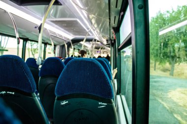 Seville, Spain - September 01, 2022 Inside a bus driving through the streets of Seville during the coronavirus outbreak hitting Spain, wearing a mask is mandatory