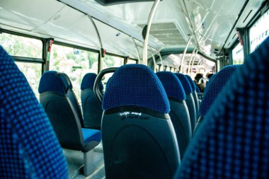 Seville, Spain - September 01, 2022 Inside a bus driving through the streets of Seville during the coronavirus outbreak hitting Spain, wearing a mask is mandatory