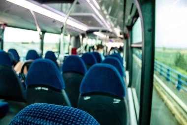Seville, Spain - September 01, 2022 Inside a bus driving through the streets of Seville during the coronavirus outbreak hitting Spain, wearing a mask is mandatory