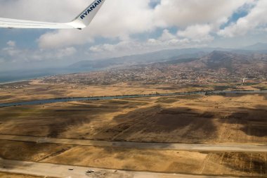 Seville, Spain - August 19, 2022 Commercial flight between the city of Seville in Spain and Tetouan in Morocco, View from the sky of the land and the Strait of Gibraltar separating Europe and Africa
