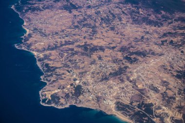 Seville, Spain - August 19, 2022 Commercial flight between the city of Seville in Spain and Tetouan in Morocco, View from the sky of the land and the Strait of Gibraltar separating Europe and Africa