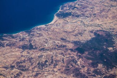 Seville, Spain - August 19, 2022 Commercial flight between the city of Seville in Spain and Tetouan in Morocco, View from the sky of the land and the Strait of Gibraltar separating Europe and Africa