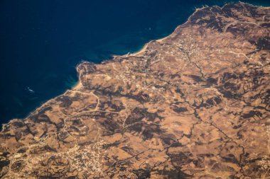 Seville, Spain - August 19, 2022 Commercial flight between the city of Seville in Spain and Tetouan in Morocco, View from the sky of the land and the Strait of Gibraltar separating Europe and Africa