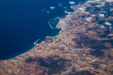 Seville, Spain - August 19, 2022 Commercial flight between the city of Seville in Spain and Tetouan in Morocco, View from the sky of the land and the Strait of Gibraltar separating Europe and Africa