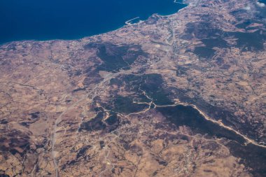 Seville, Spain - August 19, 2022 Commercial flight between the city of Seville in Spain and Tetouan in Morocco, View from the sky of the land and the Strait of Gibraltar separating Europe and Africa