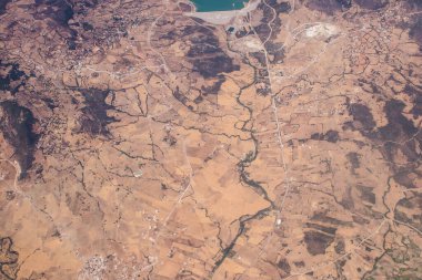 Seville, Spain - August 19, 2022 Commercial flight between the city of Seville in Spain and Tetouan in Morocco, View from the sky of the land and the Strait of Gibraltar separating Europe and Africa
