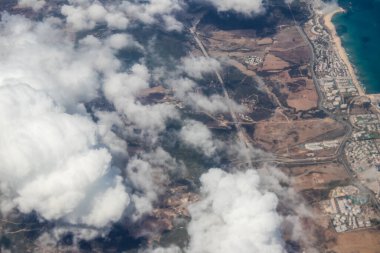 Seville, Spain - August 19, 2022 Commercial flight between the city of Seville in Spain and Tetouan in Morocco, View from the sky of the land and the Strait of Gibraltar separating Europe and Africa