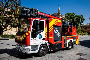 Seville, Spain - September 01, 2022 Fire truck rolling through the streets of Seville during the coronavirus outbreak hitting Spain