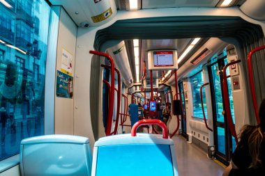 Seville, Spain - September 01, 2022 Modern electric tram for passengers rolling through the streets of Seville during the coronavirus outbreak hitting Spain, wearing a mask is mandatory