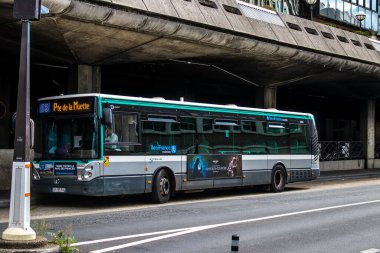 Paris, France - September 05, 2022 Bus driving through the streets of Paris, Buses are inexpensive and drop you off at any location in the capital quite quickly, many of its buses run on gas