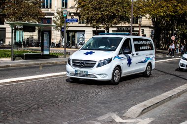 Paris, France - September 05, 2022 Ambulance driving through the streets of Paris during the coronavirus outbreak hitting France