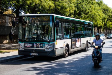 Paris, France - September 05, 2022 Bus driving through the streets of Paris, Buses are inexpensive and drop you off at any location in the capital quite quickly, many of its buses run on gas