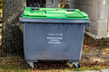 Paris, France - September 05, 2022 Garbage container in the downtown area of Paris, an emblematic city and the capital of France