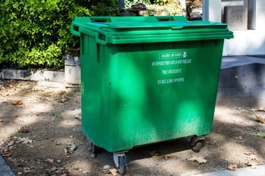 Paris, France - September 05, 2022 Garbage container in the downtown area of Paris, an emblematic city and the capital of France