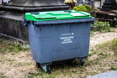 Paris, France - September 05, 2022 Garbage container in the downtown area of Paris, an emblematic city and the capital of France