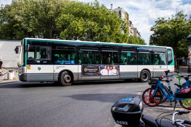 Paris, France - September 05, 2022 Bus driving through the streets of Paris, Buses are inexpensive and drop you off at any location in the capital quite quickly, many of its buses run on gas