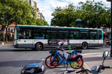 Paris, France - September 05, 2022 Bus driving through the streets of Paris, Buses are inexpensive and drop you off at any location in the capital quite quickly, many of its buses run on gas