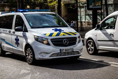 Paris, France - September 05, 2022 Ambulance driving through the streets of Paris during the coronavirus outbreak hitting France