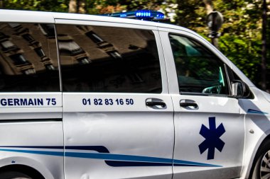 Paris, France - September 05, 2022 Ambulance driving through the streets of Paris during the coronavirus outbreak hitting France