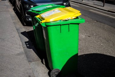 Paris, France - September 05, 2022 Garbage container in the downtown area of Paris, an emblematic city and the capital of France