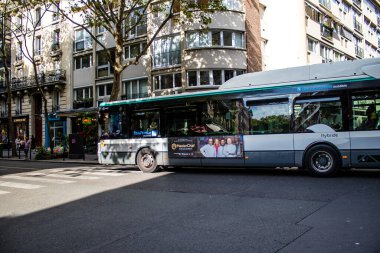 Paris, France - September 05, 2022 Bus driving through the streets of Paris, Buses are inexpensive and drop you off at any location in the capital quite quickly, many of its buses run on gas