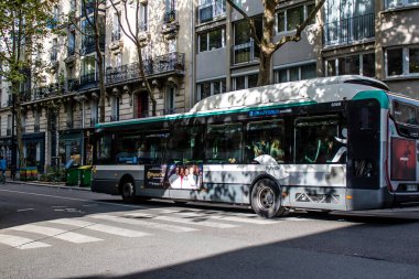 Paris, France - September 05, 2022 Bus driving through the streets of Paris, Buses are inexpensive and drop you off at any location in the capital quite quickly, many of its buses run on gas