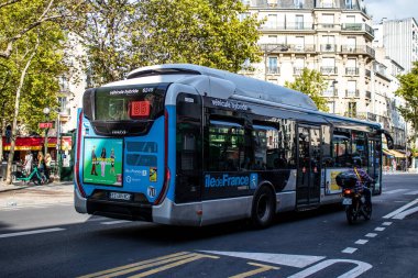 Paris, France - September 05, 2022 Bus driving through the streets of Paris, Buses are inexpensive and drop you off at any location in the capital quite quickly, many of its buses run on gas
