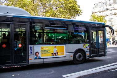 Paris, France - September 05, 2022 Bus driving through the streets of Paris, Buses are inexpensive and drop you off at any location in the capital quite quickly, many of its buses run on gas