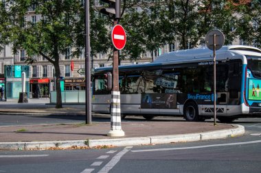 Paris, France - September 05, 2022 Bus driving through the streets of Paris, Buses are inexpensive and drop you off at any location in the capital quite quickly, many of its buses run on gas