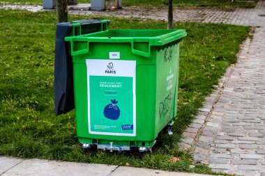 Paris, France - September 05, 2022 Garbage container in the downtown area of Paris, an emblematic city and the capital of France