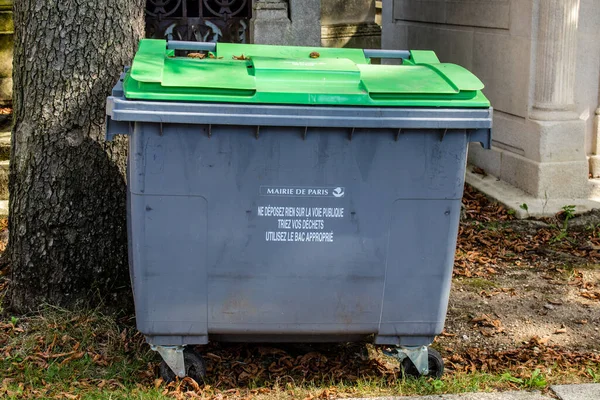 Paris, France - September 05, 2022 Garbage container in the downtown area of Paris, an emblematic city and the capital of France