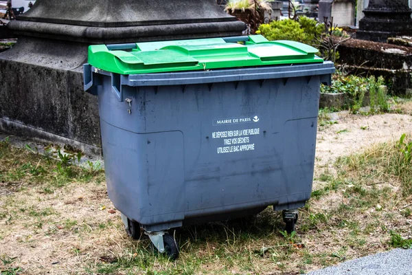 Paris, France - September 05, 2022 Garbage container in the downtown area of Paris, an emblematic city and the capital of France