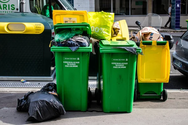 Paris, France - September 05, 2022 Garbage container in the downtown area of Paris, an emblematic city and the capital of France