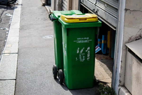 Paris, France - September 05, 2022 Garbage container in the downtown area of Paris, an emblematic city and the capital of France