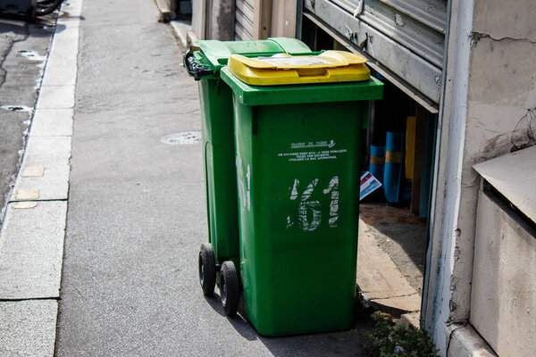 Paris, France - September 05, 2022 Garbage container in the downtown area of Paris, an emblematic city and the capital of France