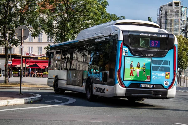 Paris, France - September 05, 2022 Bus driving through the streets of Paris, Buses are inexpensive and drop you off at any location in the capital quite quickly, many of its buses run on gas