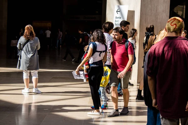 stock image Paris, France - September 08, 2022 The Louvre, the largest museum in the world, tourists at the main entrance, visitors wander the aisles to admire ancient sculptures and paintings by masters