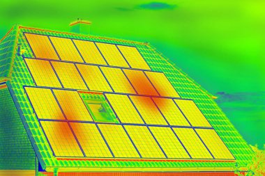 Thermographic inspection of photovoltaic systems by house.Thermovision image of solar panels. Infrared thermovision image. Infrared thermography in inspection of photovoltaic panels.  clipart
